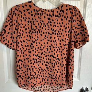 Spring leopard cheetah print cute top with tie in the back at the neck.